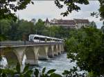 Thurbo GTW RABe 526 triple unit is running on the bridge over the Rhine Falls in Neuhausen am Rheinfall on September 13th, 2012.
